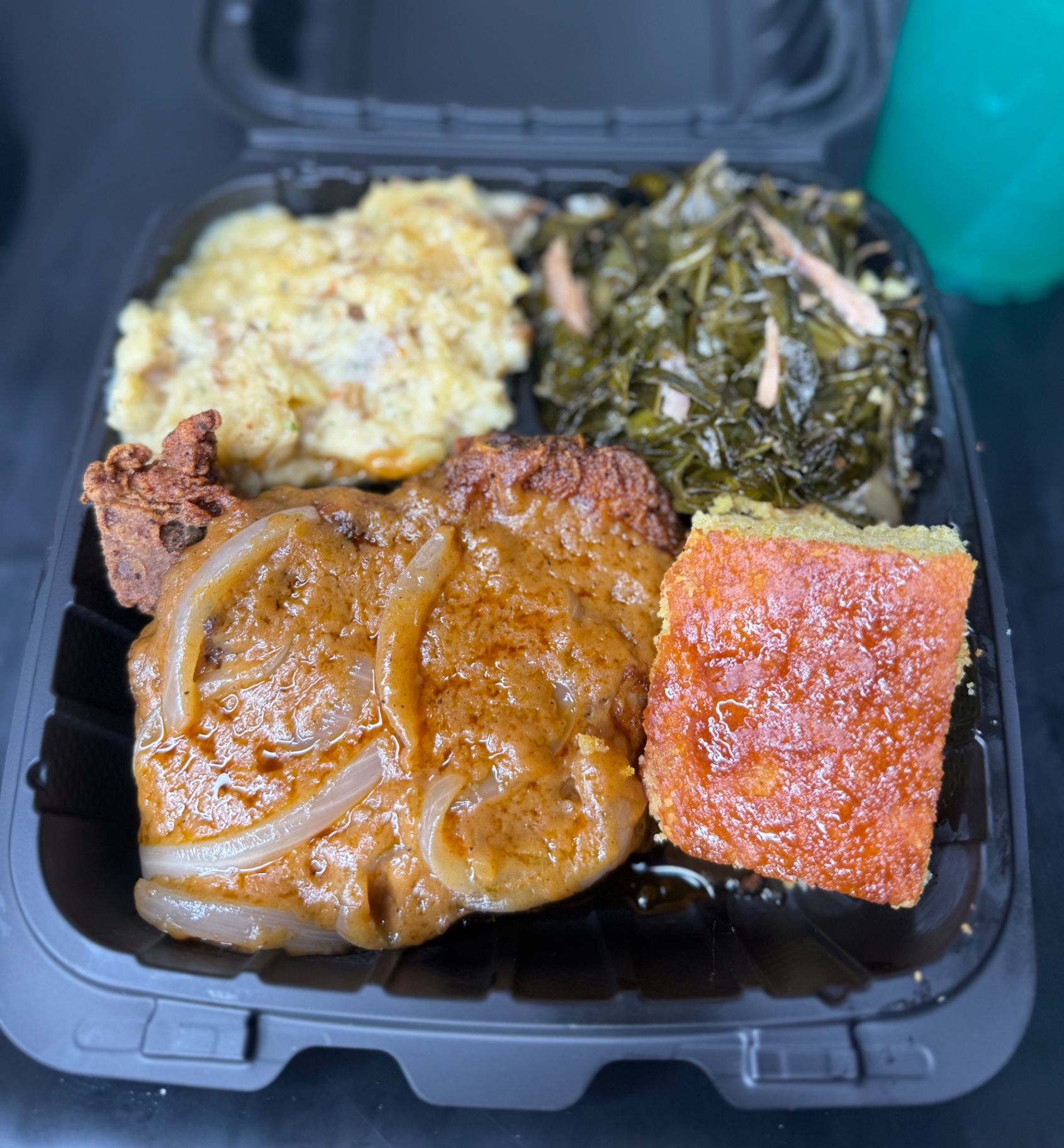 Soul food plate with catfish, lamb chops, mac and cheese and greens
